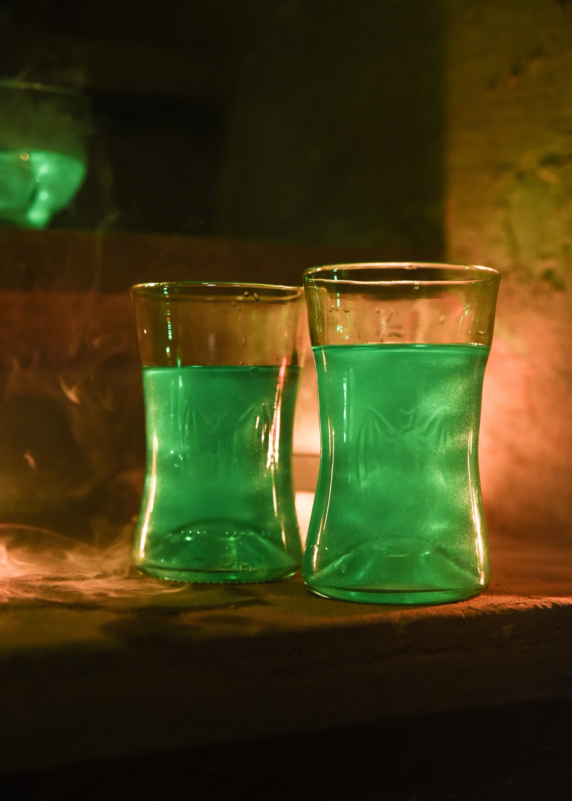 two recycled glass bat glasses