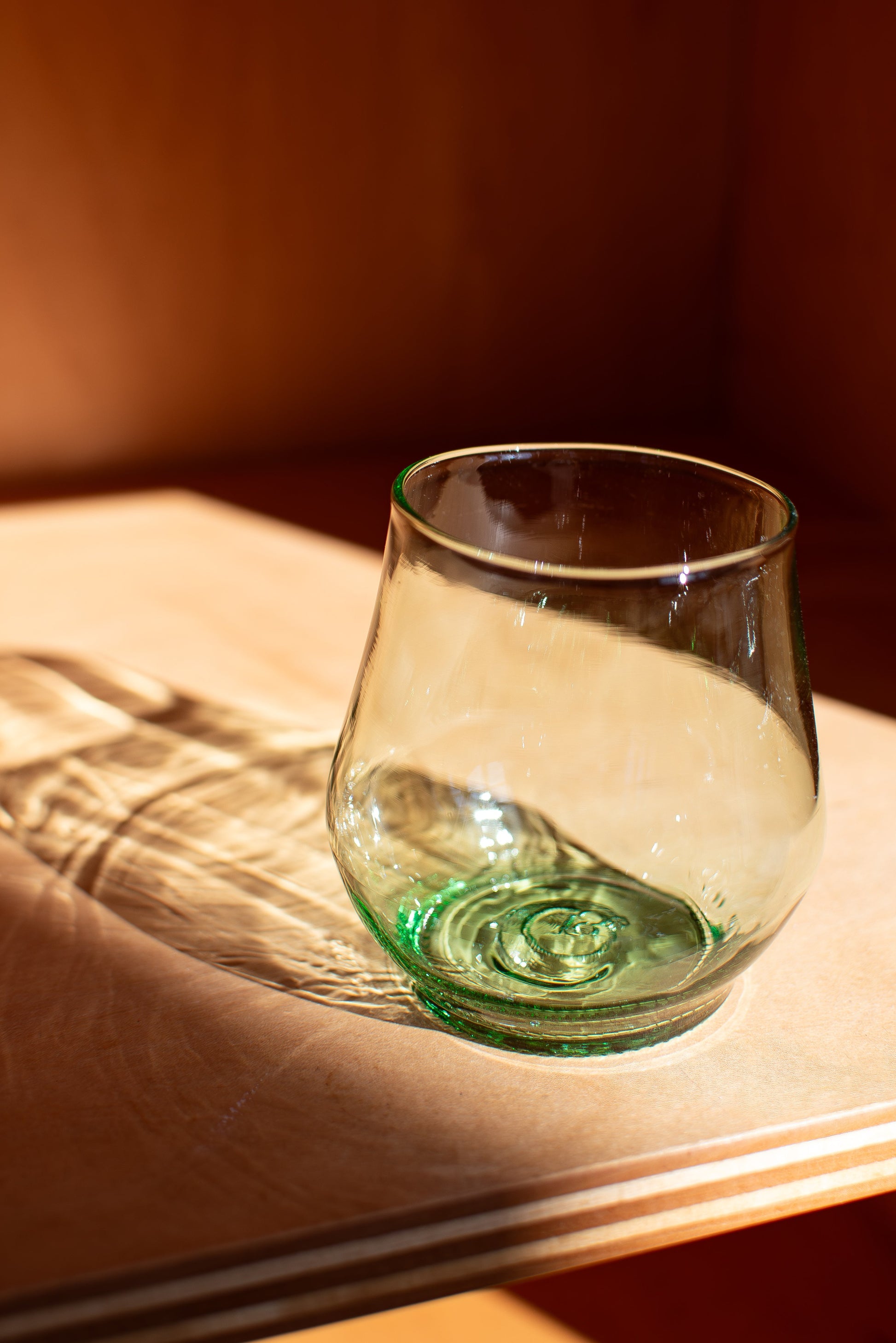 aqua short glass with red background
