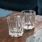 two rock glasses sitting on table
