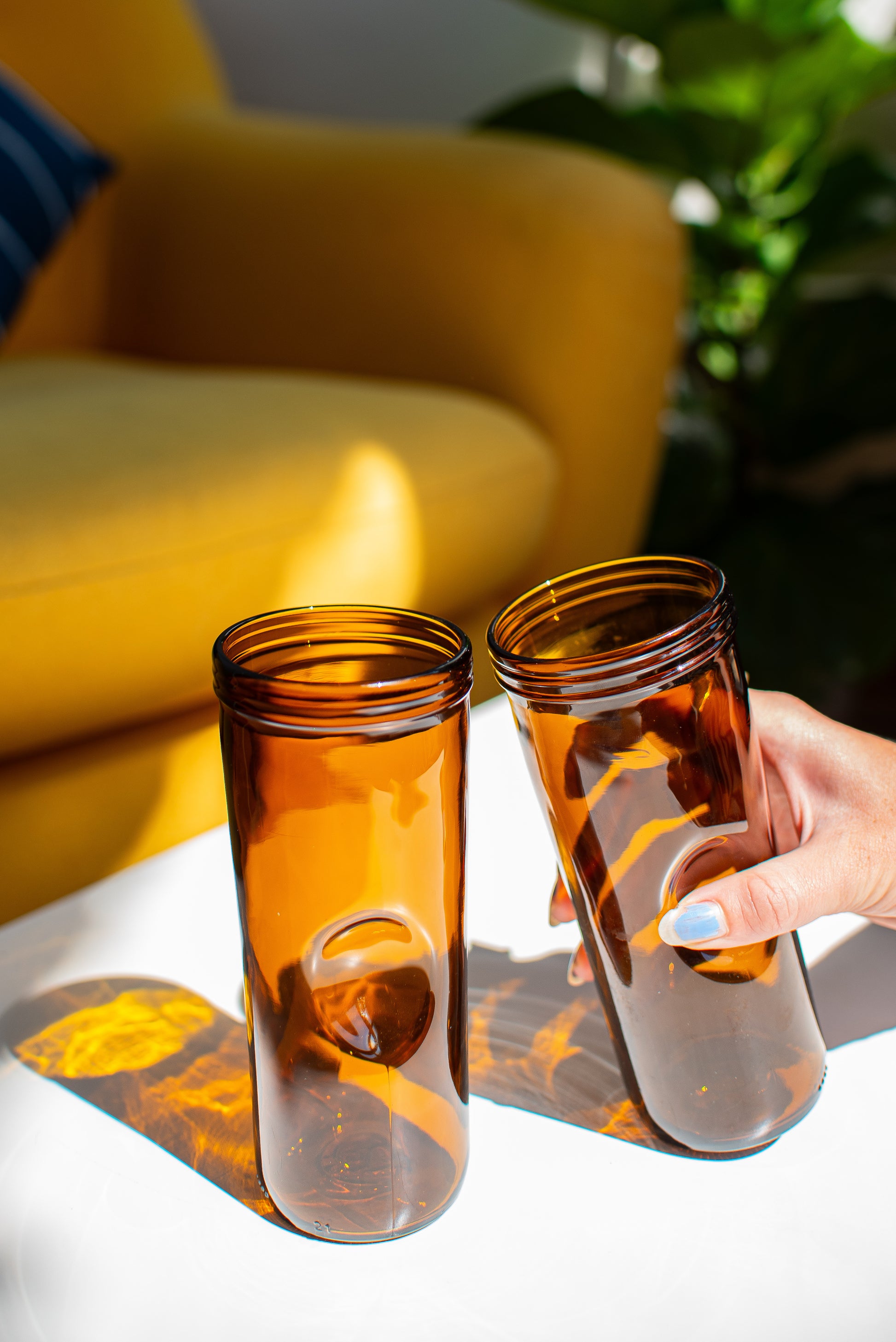 two brown pint glass
