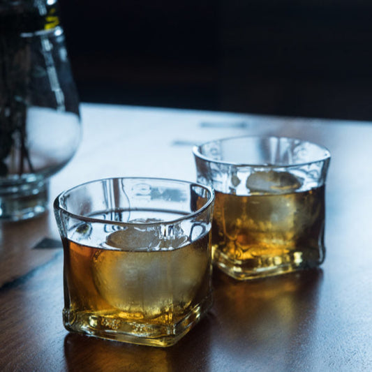 square rocks glasses made from recycled glass with whisky cocktail