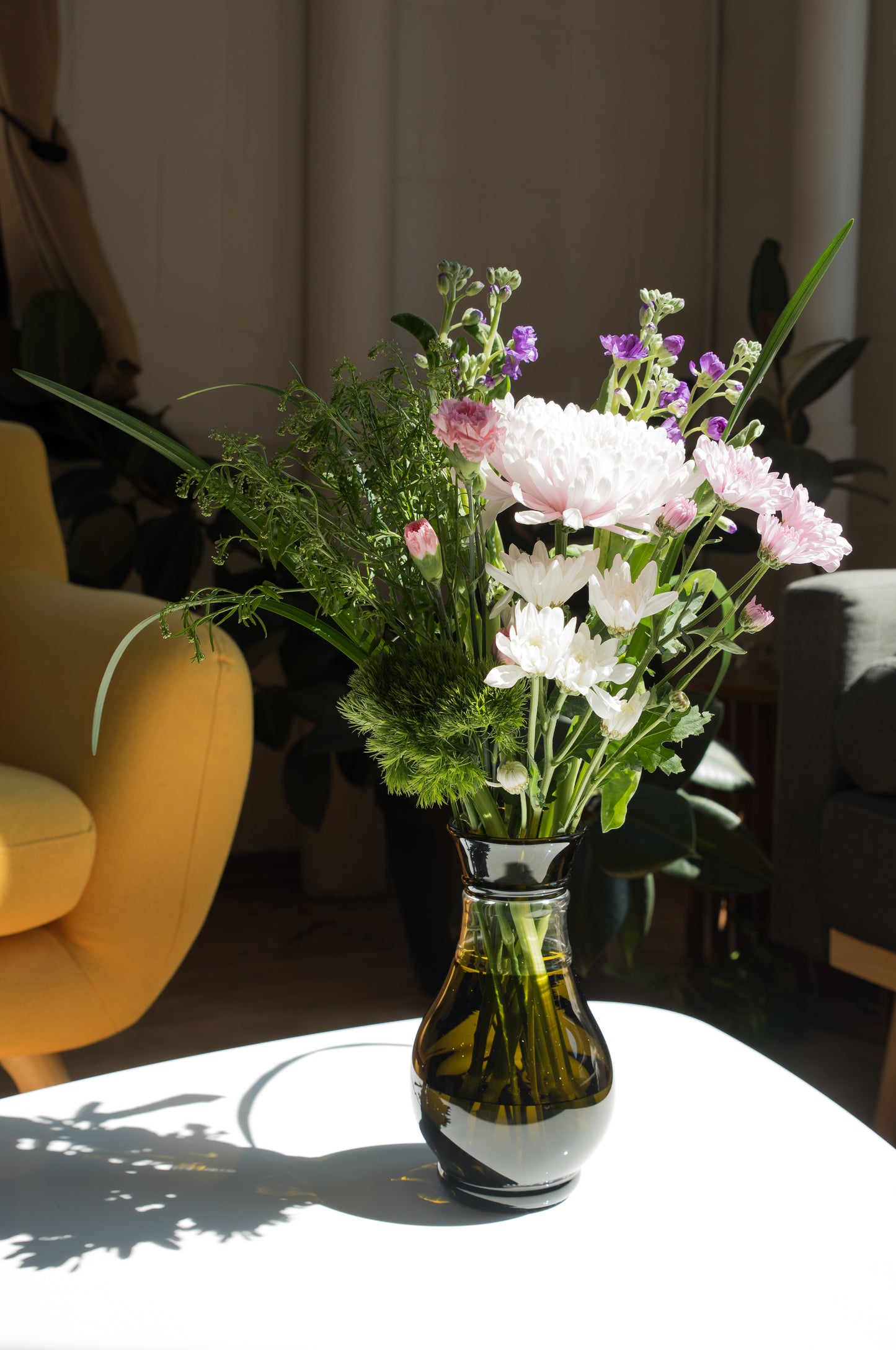 olive vase made from wedding champagne keepsake bottle in living room