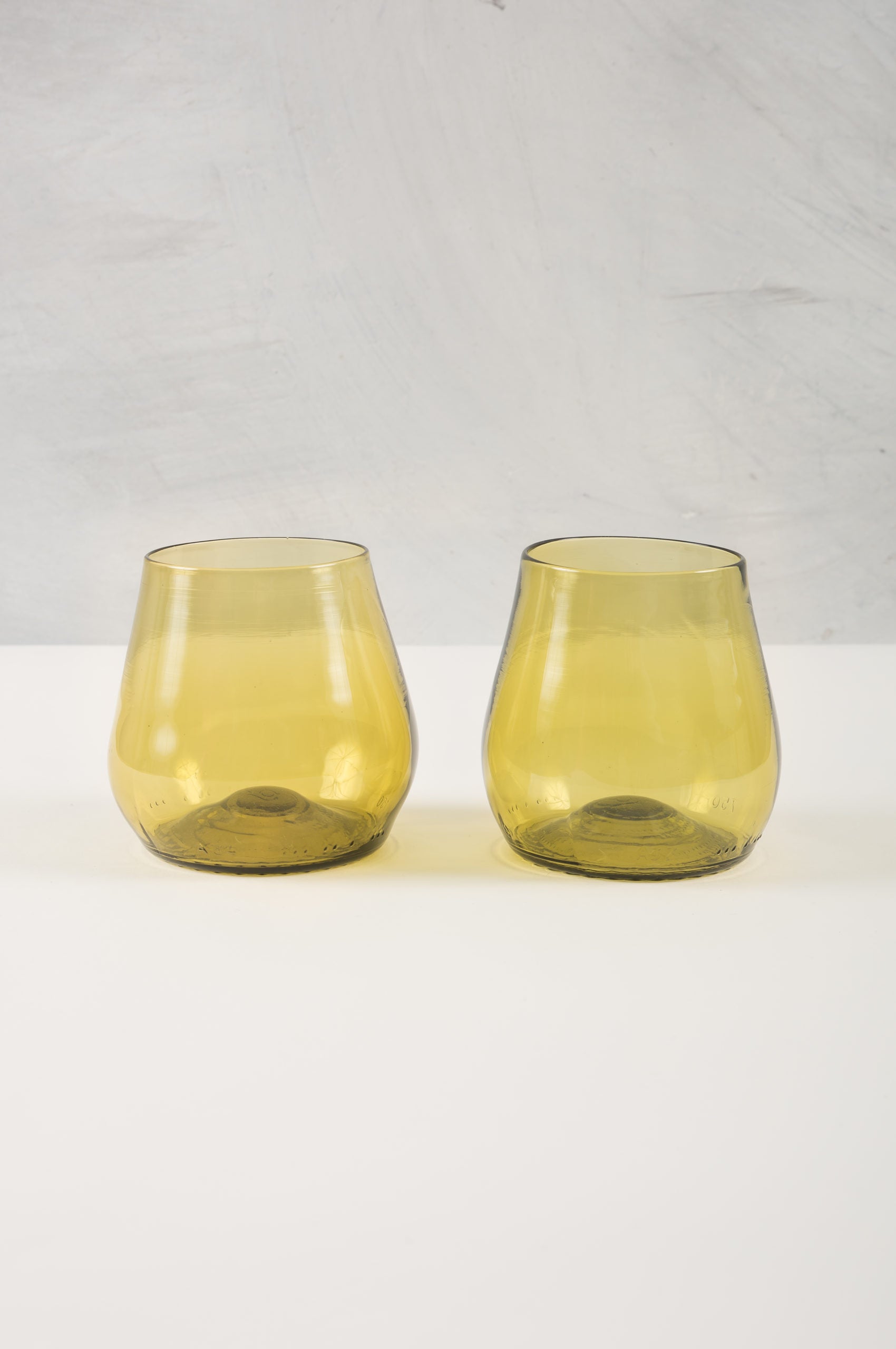 gold water or wine glasses made from recycled glass
