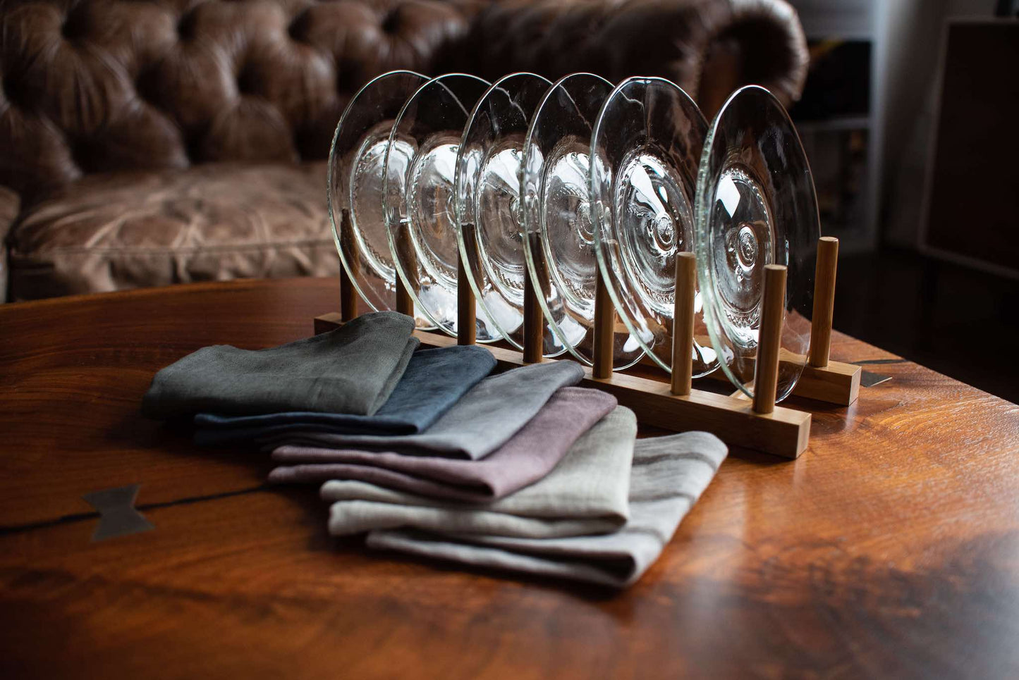 set of six clear appetizer side plates made from recycled glass in wooden rack