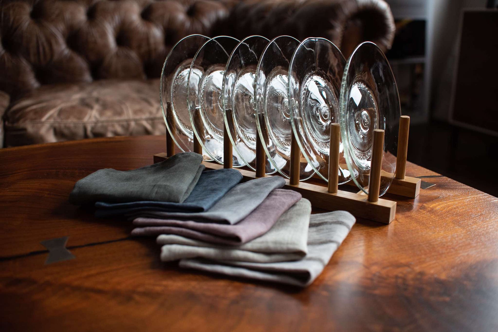 set of six clear appetizer side plates made from recycled glass in wooden rack