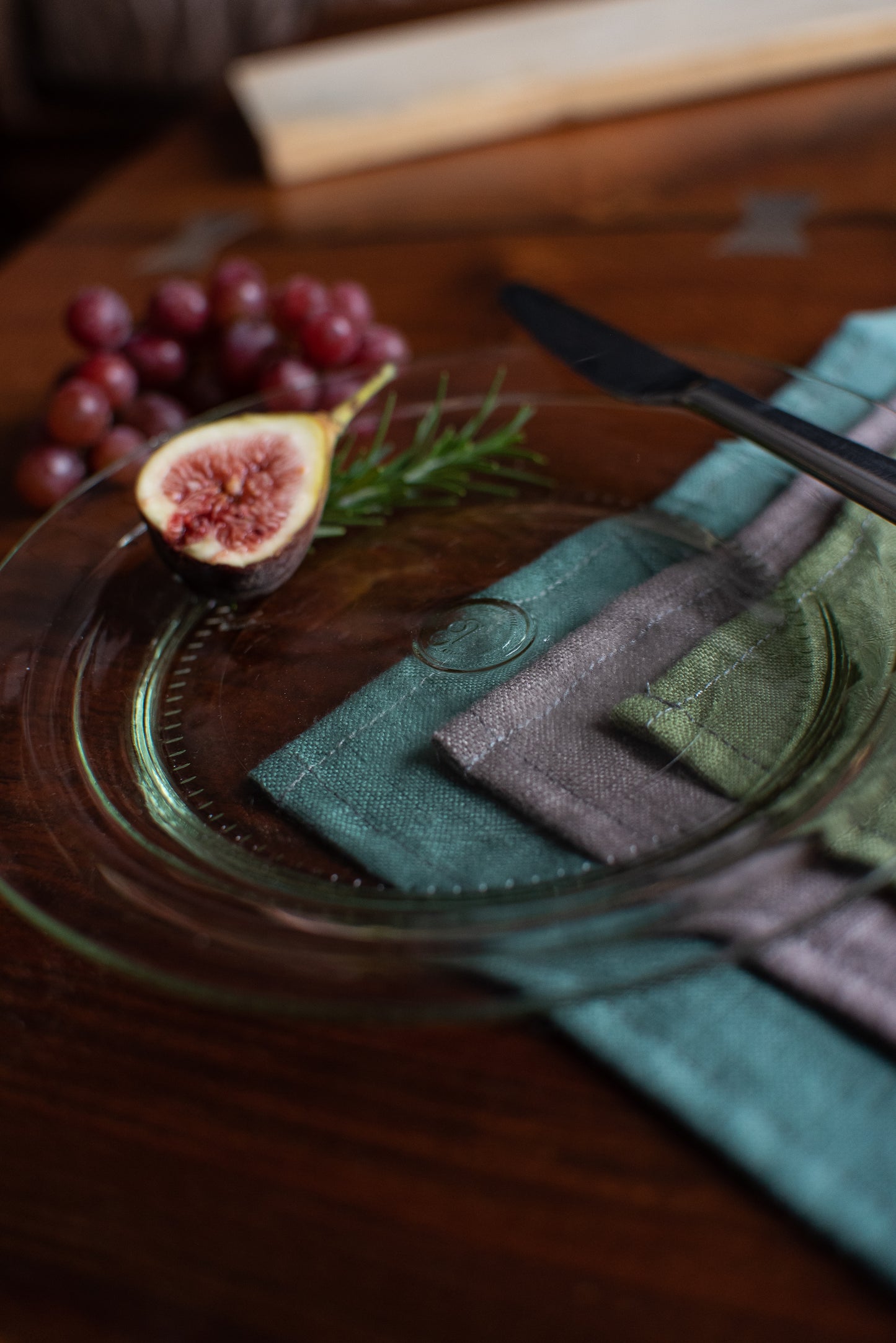 clear appetizer side plate made from recycled glass with fresh fig and rosemary