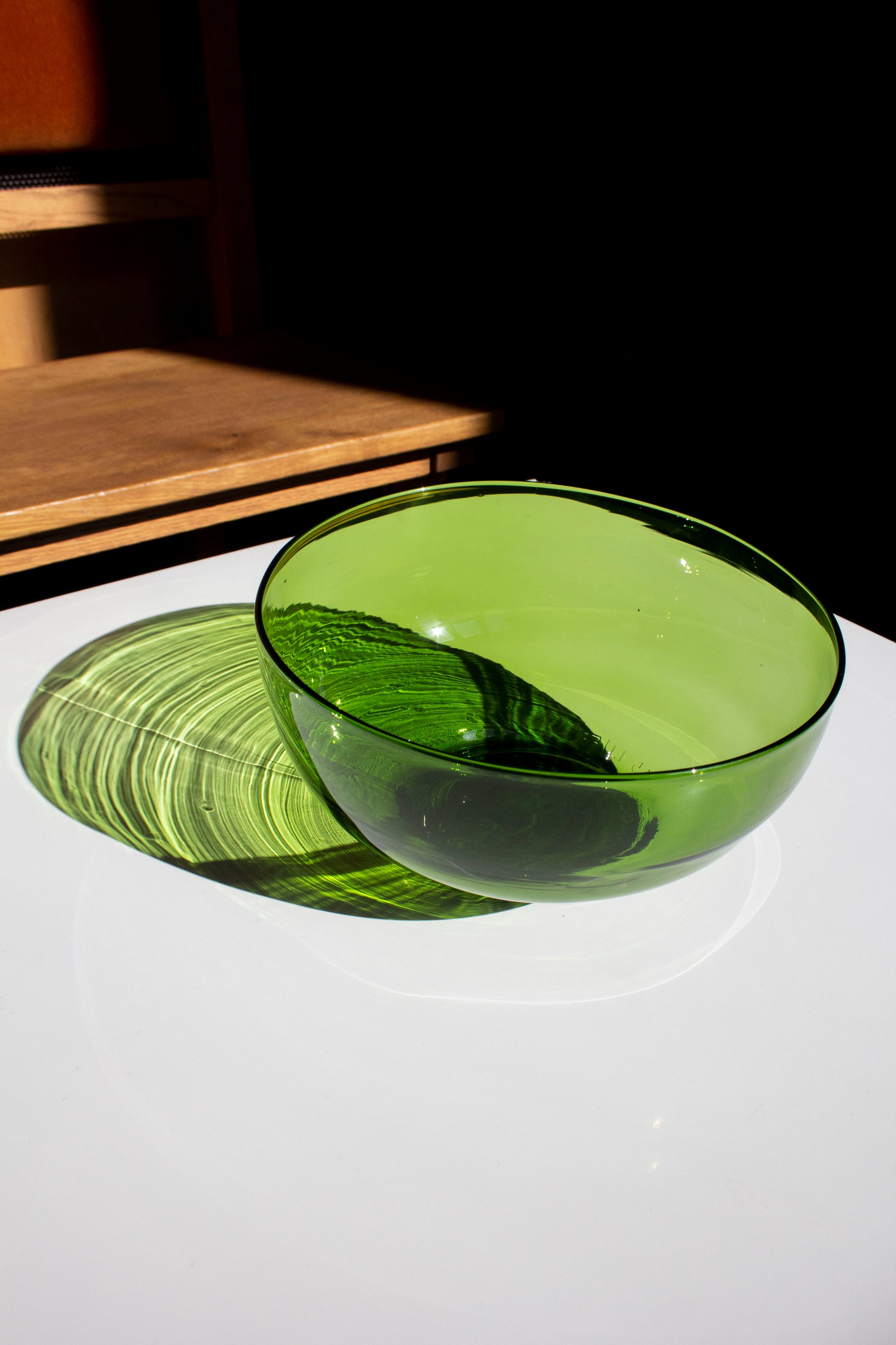 A large nesting bowl made from an emerald recycled bottle