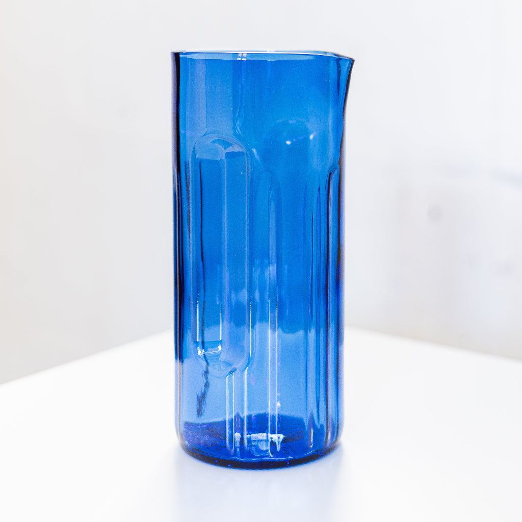 Blue glass vase on a white background