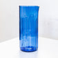 Blue glass vase on a white background