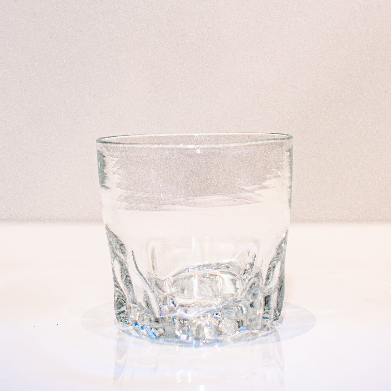 clear rocks glass with rose imprinted bottom