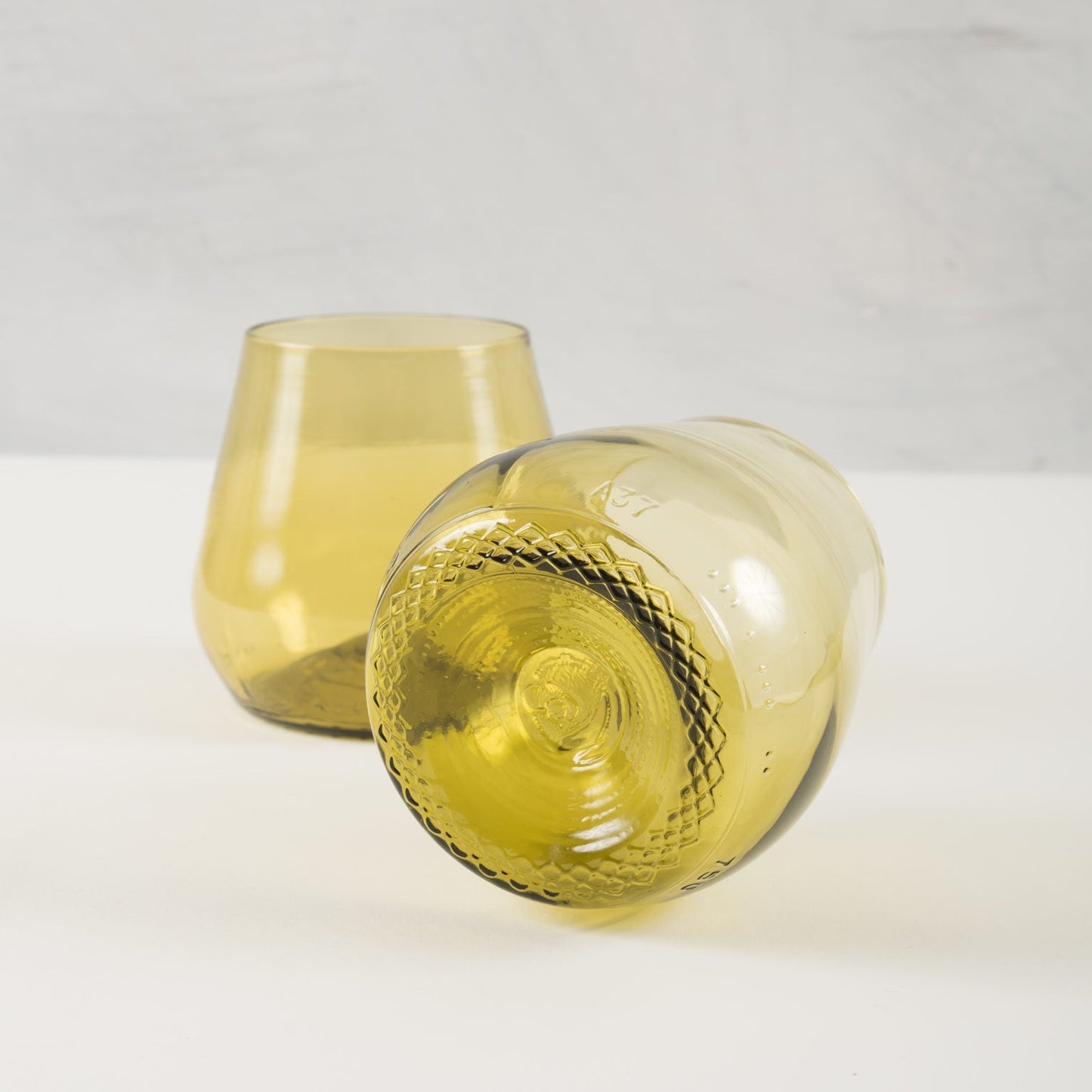 gold water or wine glasses made from recycled glass