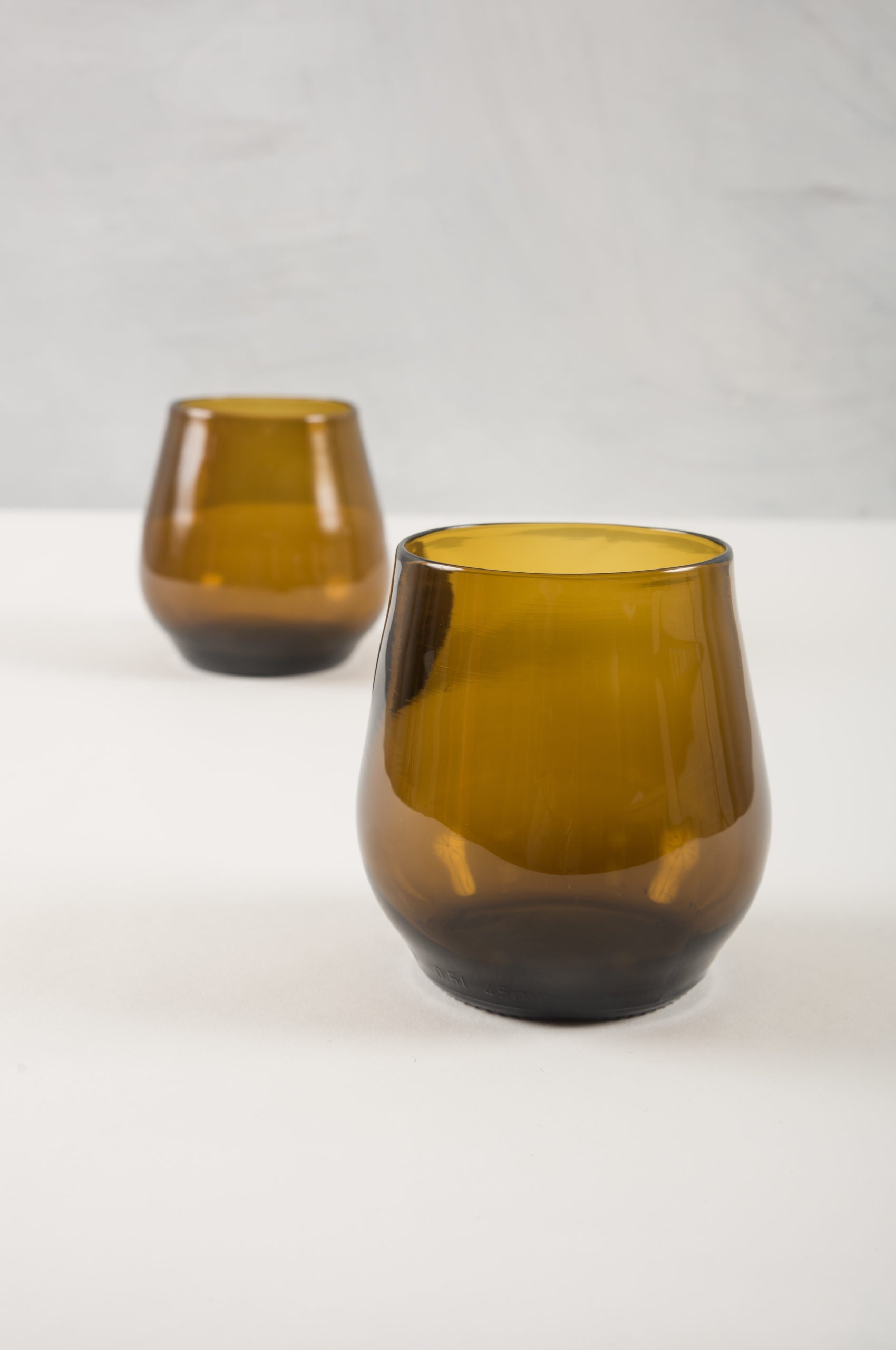 amber water or wine glasses made from recycled glass