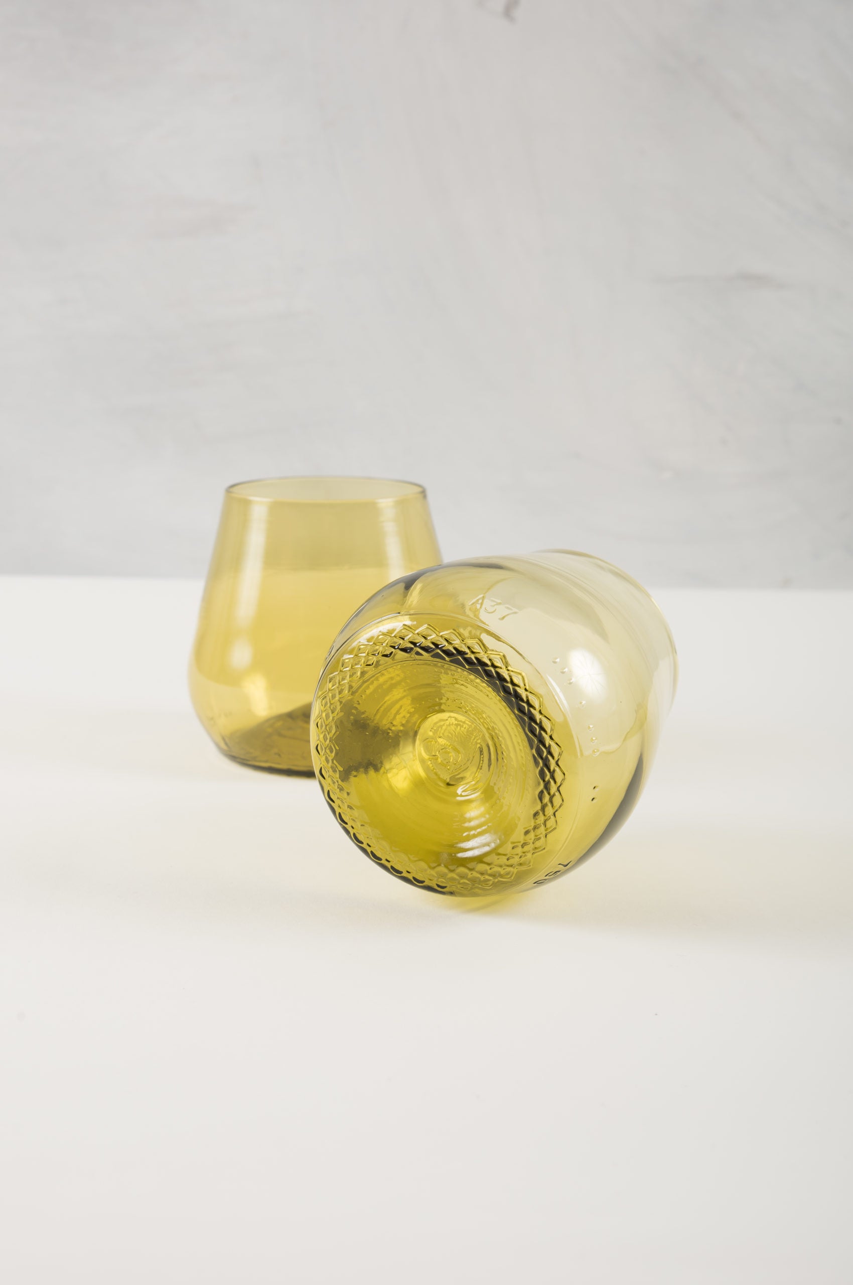 gold water or wine glasses made from recycled glass