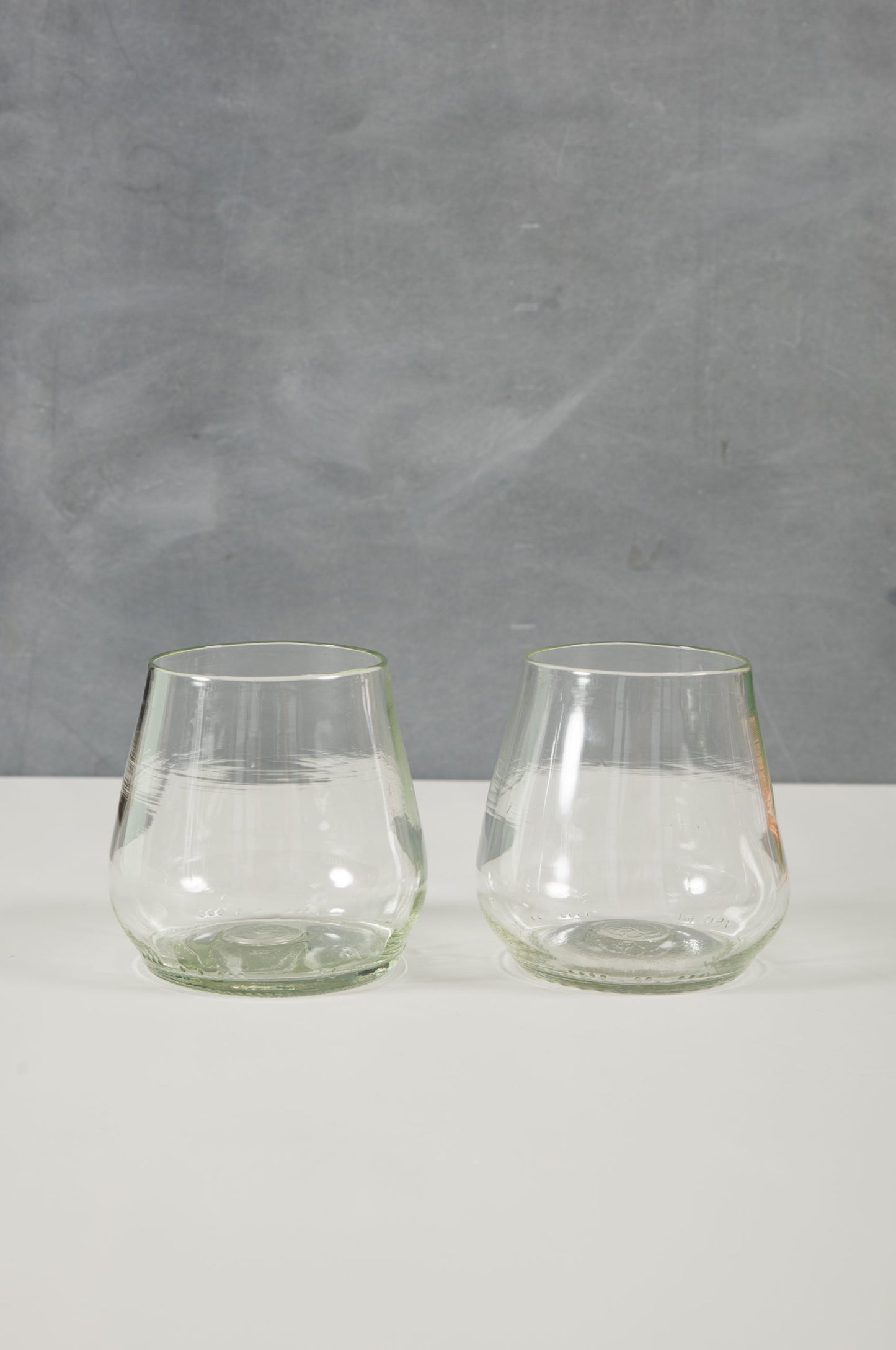 clear wine or water glasses made from recycled glass