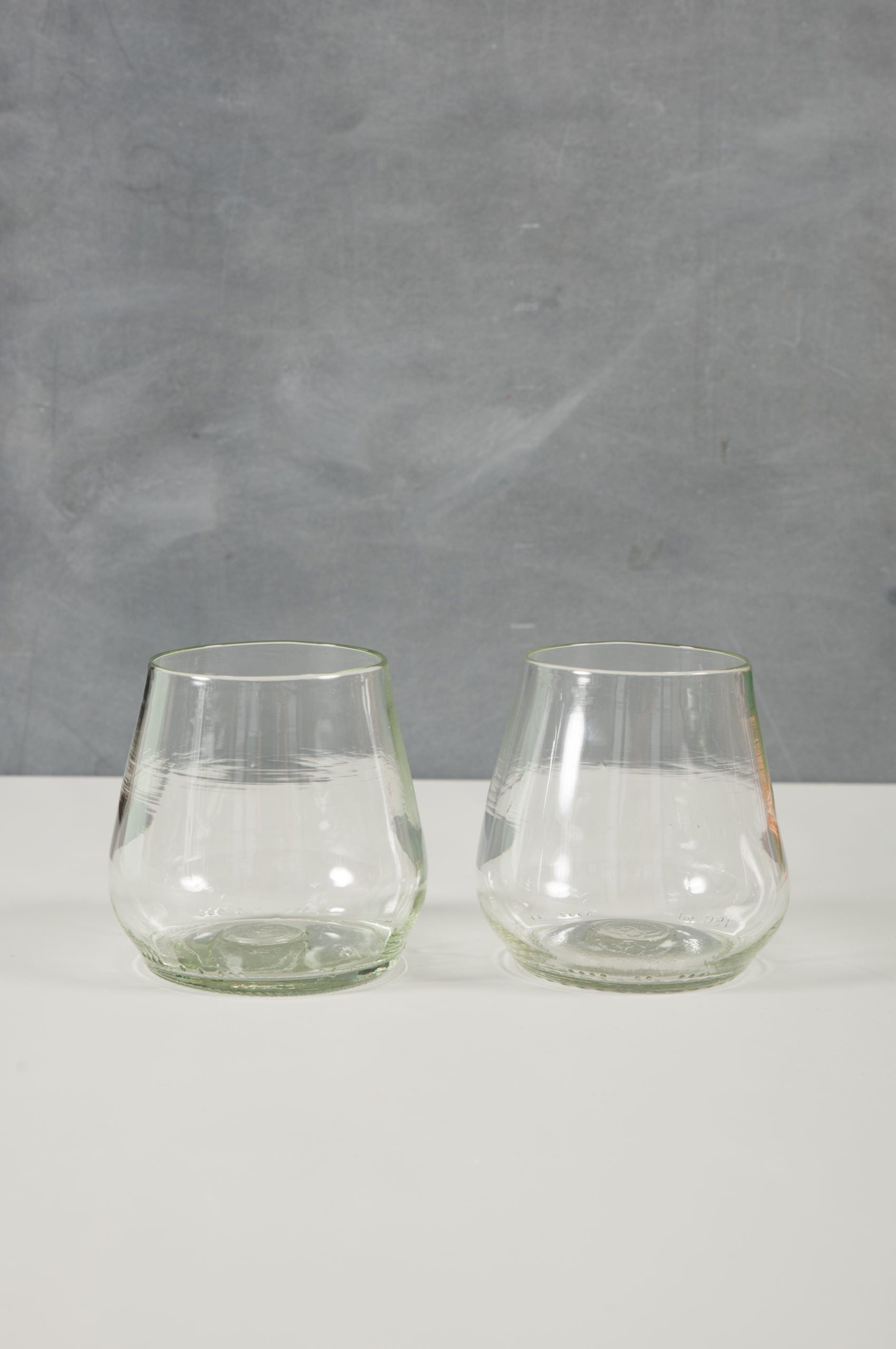 clear wine or water glasses made from recycled glass