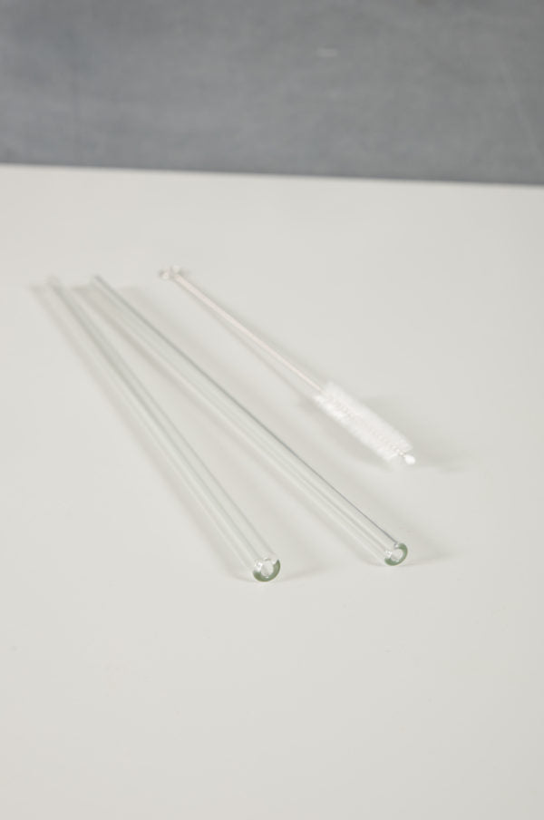two recycled glass straws and straw cleaner